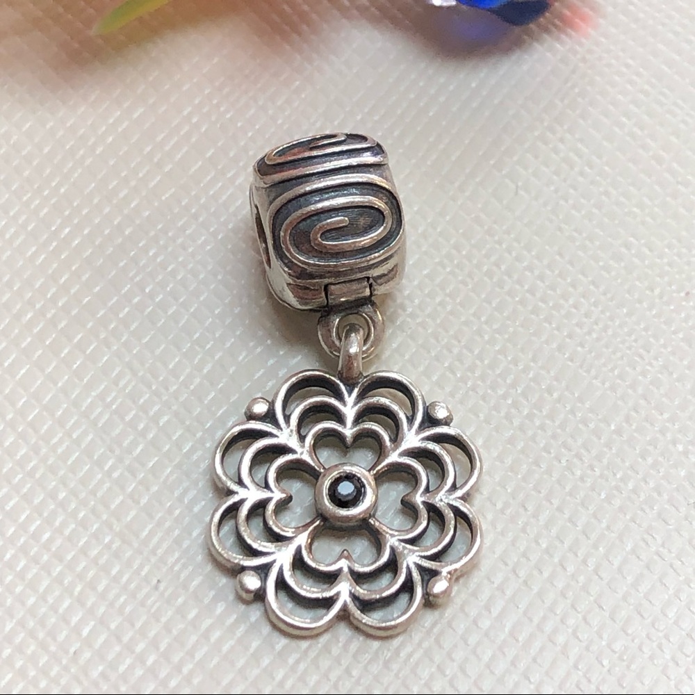 Pandora charm dangling flower discontinued.
